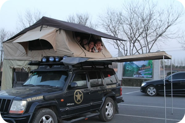 Pretty girls enjoy camping with roof top tent